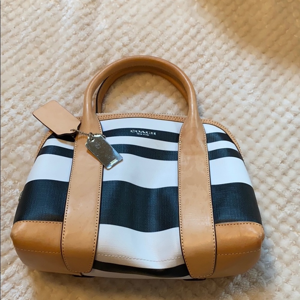 Small black and white coach handbag